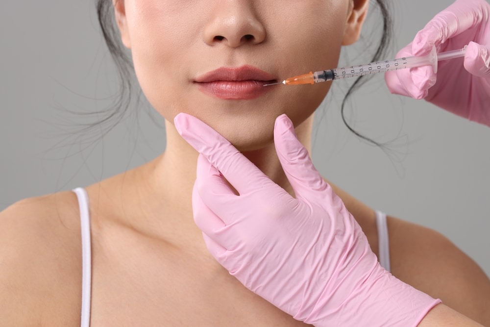 Close up of woman’s lips as she gets lip injections in Fort Worth.